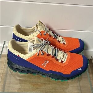 On Running Vibrant Orange and Blue Shoes